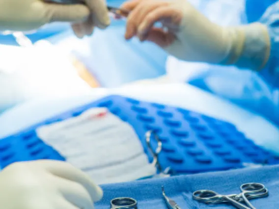 Medical instruments stacked in a tray.