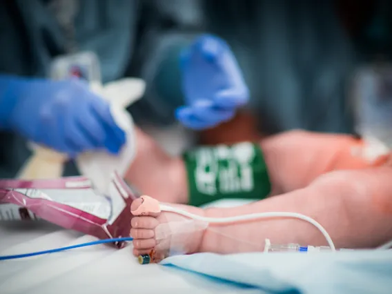 Infant on surgical table.
