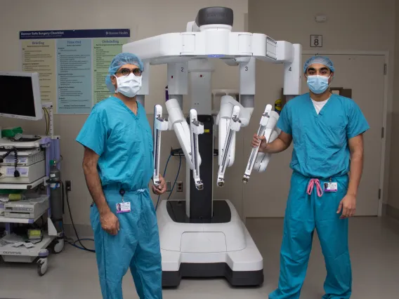 Dr. Ghaderi and Dr. Ajmal with robot