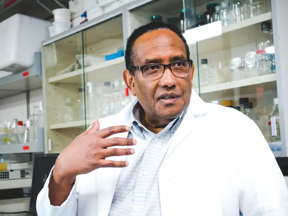 Dr. Zakaria talking in lab 