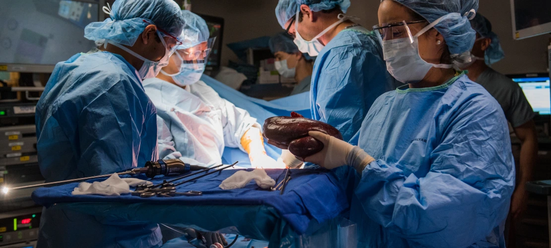 Surgeons in the OR room performing a transplant surgery