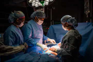 Operating room with medical professionals.