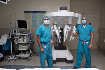 Dr. Ghaderi and Dr. Ajmal with robot